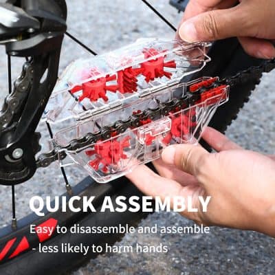 - Transparent bike chain tool kit for quick assembly and disassembly of bicycle chains, including red gear components and a chain breaker.
