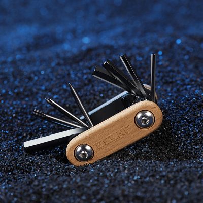 Multi-tool knife with black metal blades and a wooden handle for precision use, ideal for outdoor activities, camping, and everyday carry.
