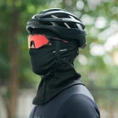 Helmet, goggles, and face mask for outdoor sports or cycling, showcasing safety gear with a black helmet and red tinted goggles. Perfect for active lifestyle, cycling, mountain biking, or outdoor adventures.