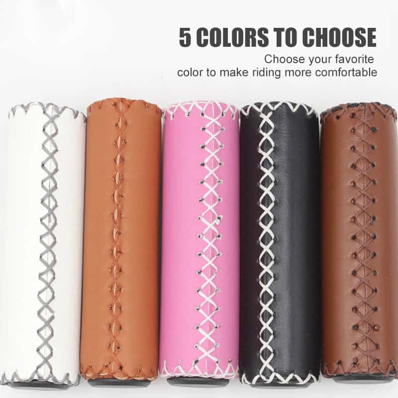 White, tan, pink, black, and brown bicycle handlebar grips with decorative stitching for comfortable riding.