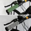 Bright green and black ergonomic bicycle handlebar grip with honeycomb pattern, designed for comfort and style in cycling.