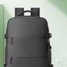 Water-resistant black backpack for travel and daily use, with multiple compartments and ergonomic design. Perfect for students, professionals, and travelers. Stylish and functional carryall.