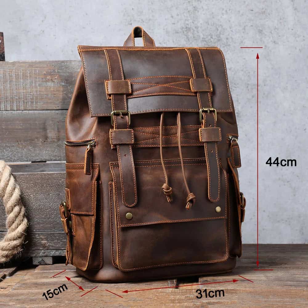Rich brown leather backpack with multiple pockets, adjustable straps, and vintage style, perfect for fashion-forward and practical daily use.
