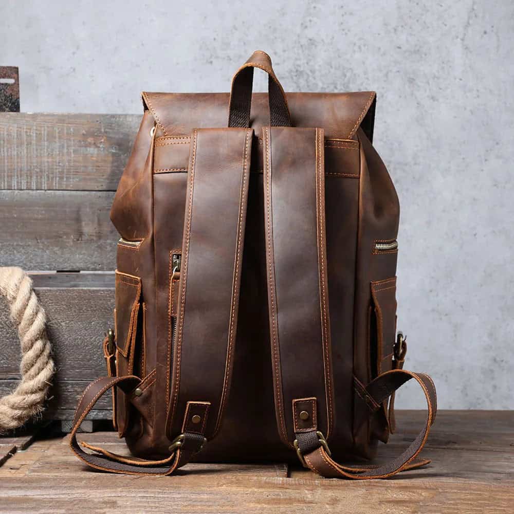 Vegan leather backpack with multiple compartments, stylish design, and adjustable straps, ideal for everyday use and travel, perfect for fashion-forward individuals.