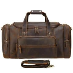 Leather travel duffel bag with multiple compartments for effective organization. Perfect for business trips or weekend getaways, offering durability and style for the modern traveler.