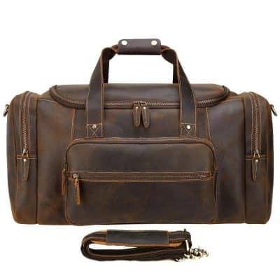 Leather travel duffel bag with multiple compartments for effective organization. Perfect for business trips or weekend getaways, offering durability and style for the modern traveler.