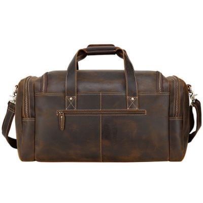 Vintage brown leather travel duffel bag for men and women, waterproof overnight weekend bag with multiple compartments and adjustable shoulder strap, stylish travel accessories.
