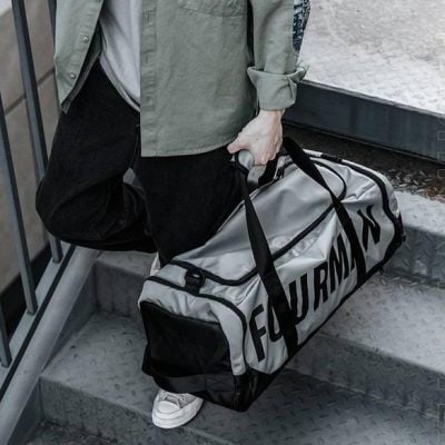 Duffel bag with "FURNAMA" logo, stylish travel accessory for men and women, ideal for gym, sports, or weekend getaways from Monalisa Store.