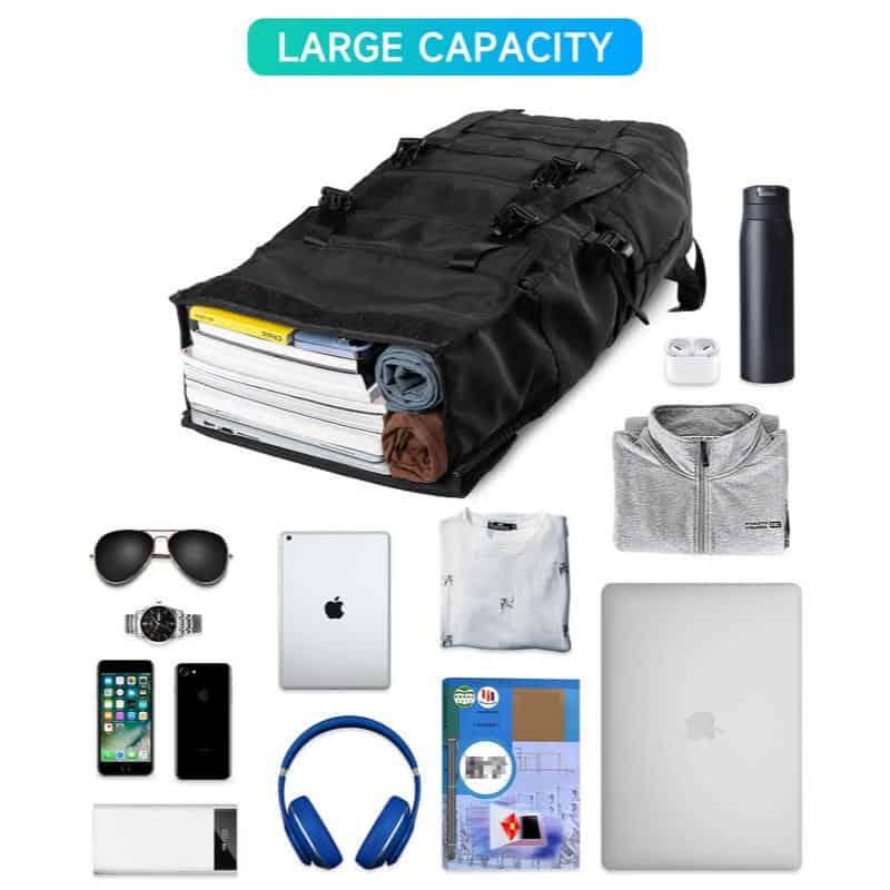 Stylish black travel bag packed with clothes, gadgets, and accessories for convenience and large capacity. Perfect for business trips or vacations, ensuring all essentials are organized and easily accessible.
