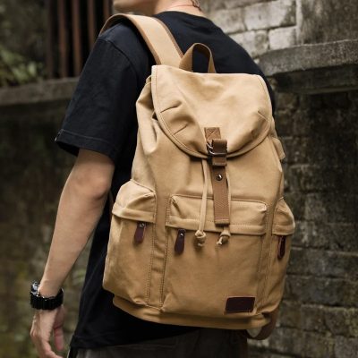 Durable beige backpack with multiple compartments for travel, school, or outdoor adventures, crafted for style and practicality. Perfect for everyday use and carrying essentials comfortably.