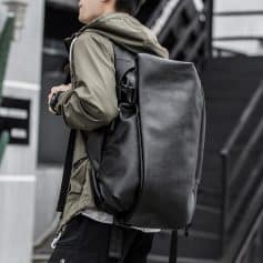 Stylish black leather backpack for men with multiple compartments, perfect for travel, work, or daily use, showcasing high-quality craftsmanship and modern design.