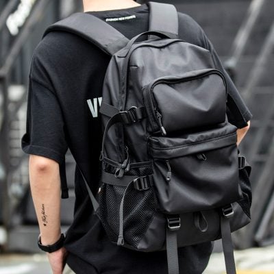 Black tactical backpack with multiple compartments, adjustable straps, and breathable mesh pockets for travel, outdoor adventures, or daily use. Durable and spacious for all your essentials.