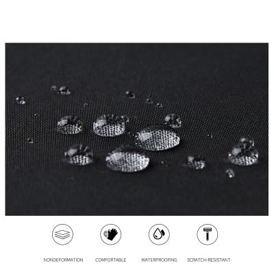 Water-resistant fabric with water droplets on black textile, showcasing durability and waterproof qualities.