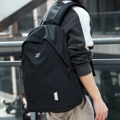 Black backpack for students and commuters with multiple compartments for laptop and accessories - Monalisa Store.