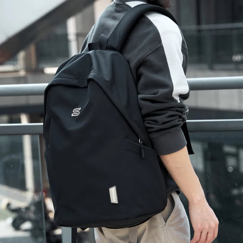Black backpack for students and commuters with multiple compartments for laptop and accessories - Monalisa Store.