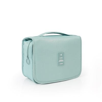 Light blue travel toiletry bag for grooming and personal care essentials, perfect for vacations and trips. Stylish, compact, and durable, ideal for organizing toiletries on the go.