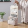Portable hanging toiletry bag for travel storage, ideal for cosmetics, toiletries, and accessories, featuring multiple compartments and mesh pockets.