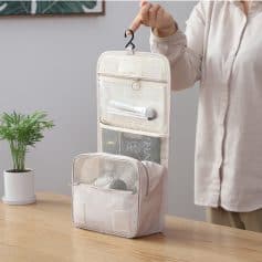 Hanging toiletry bag for travel with multiple compartments, ideal for organizing cosmetics and personal items at Monalisa Store.