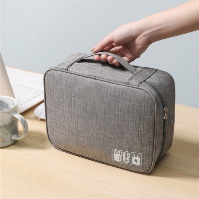 Portable medical or tech carrying case with USB ports and battery icons, ideal for organizing medical or electronic devices for healthcare professionals and patients.