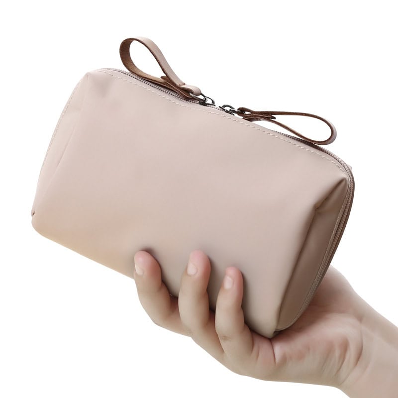 Premium beige leather clutch bag for women, perfect for fashion accessories and everyday use. Elegant and functional, ideal for carrying essentials in style.