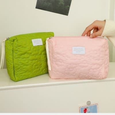 Bright green and soft pink quilted cosmetic bags at Monalisa Store, ideal for skincare and beauty essentials, showcasing stylish storage solutions for beauty lovers.