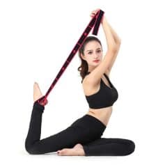 Flexible yoga pose with resistance band, demonstrating flexibility and strength, ideal for fitness and workout routines at Monalisa Medical Store.