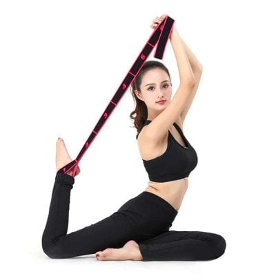 Flexible yoga pose with resistance band, demonstrating flexibility and strength, ideal for fitness and workout routines at Monalisa Medical Store.