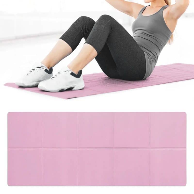 Pink exercise yoga mat for home workouts and fitness routines. Durable, cushioned, non-slip surface, ideal for yoga, pilates, stretching, and general fitness activities. Perfect for all skill levels.
