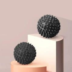 Black spiky massage balls for eye and face relaxation, modern design from Monalisa Store. Perfect for stress relief and skincare routines.
