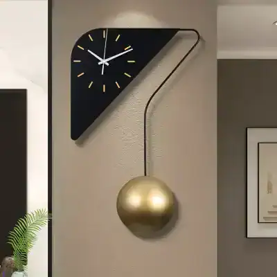 Modern wall clock with a black geometric triangle design and a gold pendulum, stylish home decor piece.