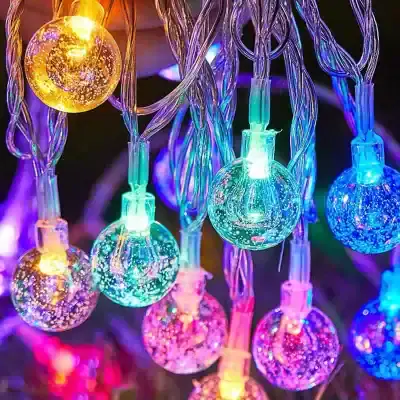 Multicolored LED string lights for interior decor, energy-efficient lighting, festive glow, perfect for homes and events, vibrant multicolor bulbs with clear wiring, creating a cheerful and inviting ambiance on Monalisa Store website.