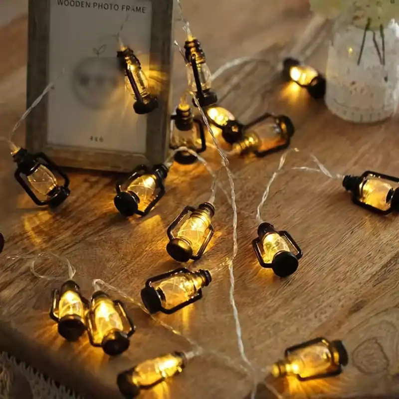 Miniature amber glass bottle string lights for cozy home decor - perfect for ambient lighting and visual appeal.
