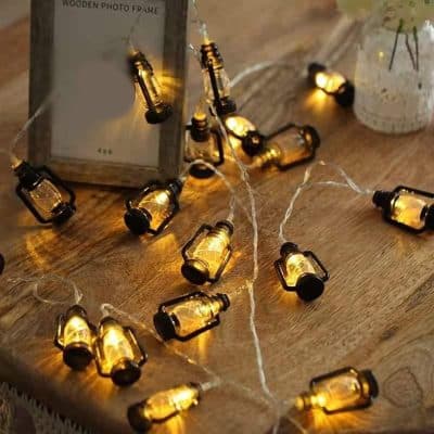 Small jar string lights for ambiance, decorative LED fairy lights, warm yellow glow indoor lighting, perfect for home decor and parties.