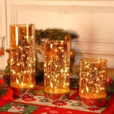 Elegant gold candle holders with warm fairy lights, perfect for holiday decorations and creating a cozy atmosphere at Monalisa Medical Store.