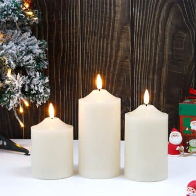 Flickering LED candles with Christmas decorations and gift boxes, perfect for holiday home decor and festive occasions.
