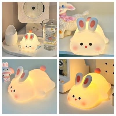 Cute bunny-shaped LED night light with pink ears and blushing cheeks for children's room decor and soothing ambiance.