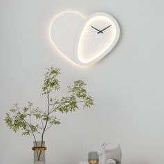 Modern minimalist wall clock with LED backlighting in a sleek, contemporary setting perfect for home or office decor.