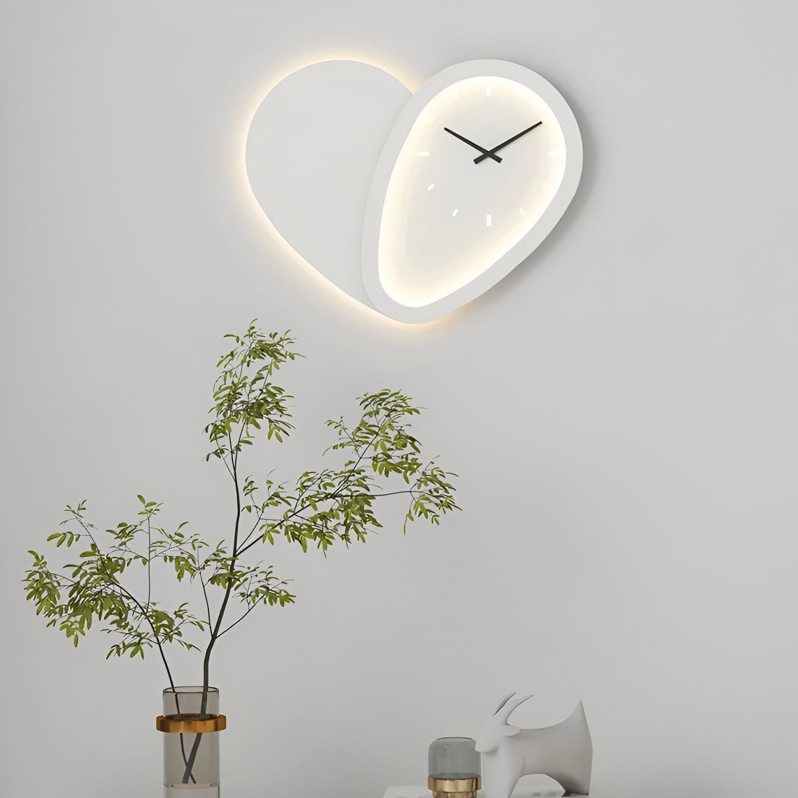 Modern minimalist wall clock with LED backlighting in a sleek, contemporary setting perfect for home or office decor.