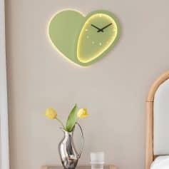 Bright green heart-shaped wall clock with LED backlight, modern design for home or office decor.