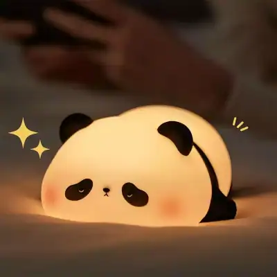Cute panda-shaped night light with soft warm glow, perfect for children’s rooms and creating a cozy ambiance. Ideal for bedroom decor, offering comfort and adorable style.