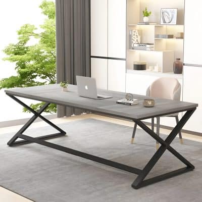 Modern workspace with stylish desk and ergonomic chair, surrounded by contemporary decor and natural light from large window featuring lush green trees, perfect for a professional setting.