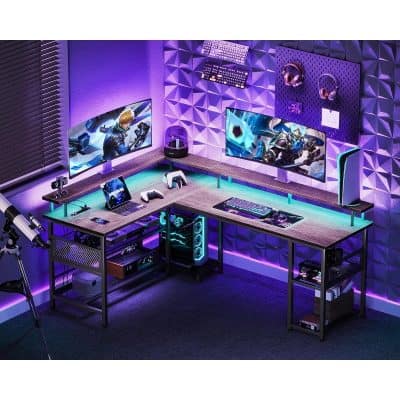 Futuristic gaming setup with dual monitors, gaming keyboard, headset, and RGB lighting in a modern office space, perfect for esports and streamers.