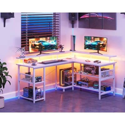 Modern gaming and tech setup with dual monitors, LED lighting, gaming peripherals, and decorative sports car models in a vibrant, stylish Monalisa Store environment optimized for tech enthusiasts and gamers.