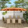 Sunshade patio umbrella with outdoor dining table and chairs, featuring string lights and lush greenery, ideal for outdoor entertaining and relaxation.