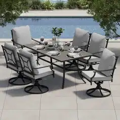Elegant outdoor dining set with cushioned chairs and a modern table near a swimming pool, perfect for luxury lifestyle and entertaining guests in a stylish backyard.