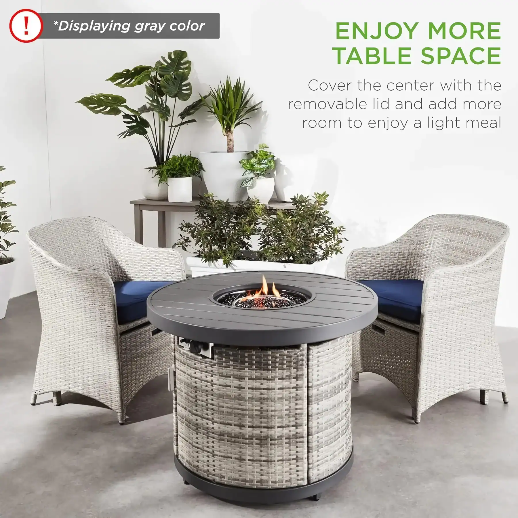 Stylish outdoor fire pit table with gray wicker base and round black top, paired with comfortable wicker armchairs, perfect for creating a cozy patio space.