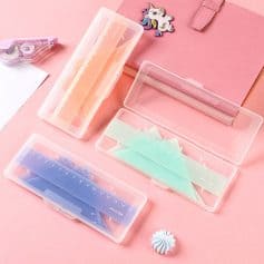 Plastic rulers and stationery sets in pink, blue, and mint for school or office use, featured in a pink Monalisa Store setting.