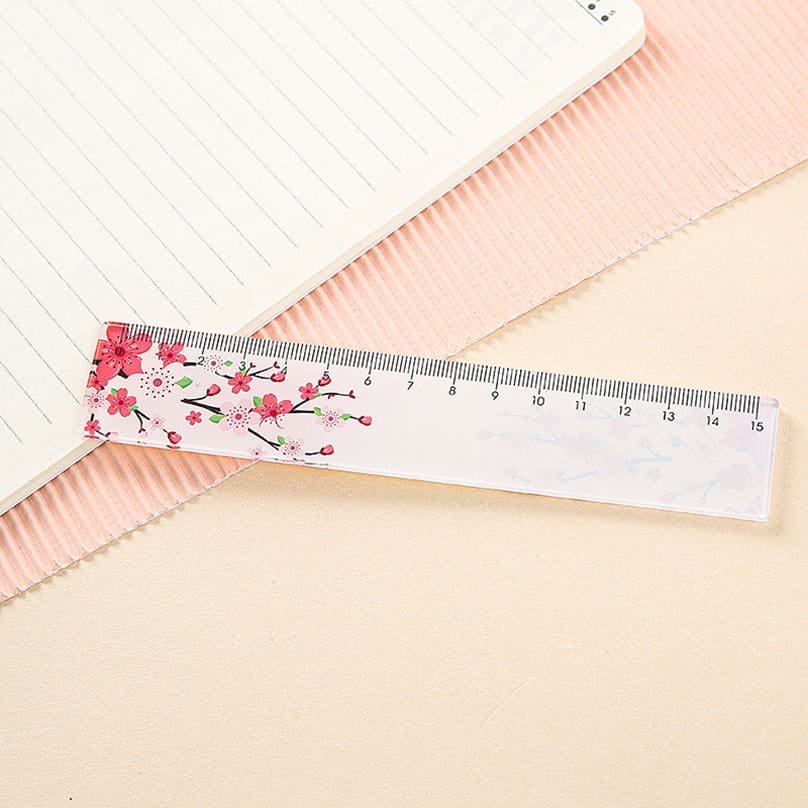 Pink cherry blossom patterned ruler for precise measurement in medical and optical settings.