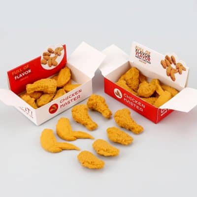 Golden crispy chicken nugget toys in branded fast-food style boxes, perfect for fun, faux fast-food play or decorations. Bright yellow, realistic chicken shapes with fresh flavor theme, ideal for kids' parties or retail displays.