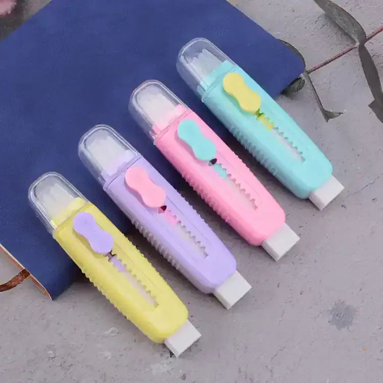 Bright pastel correction tape dispensers in yellow, purple, pink, and blue with whimsical cloud designs, perfect for school or office use.